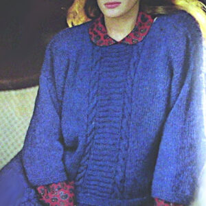 Woman wearing a blue long- sleeve pullover with a cable stitch vertical panel in the center front, knitted from worsted yarn - Vintage knitting pattern.
