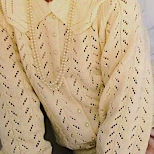 Close-Up of a White Long Sleeve Pullover Knit in Eyelet Lace Vertical Pattern from a Vintage Knitting Pattern for Sport Yarn and Sizes S, M, L.