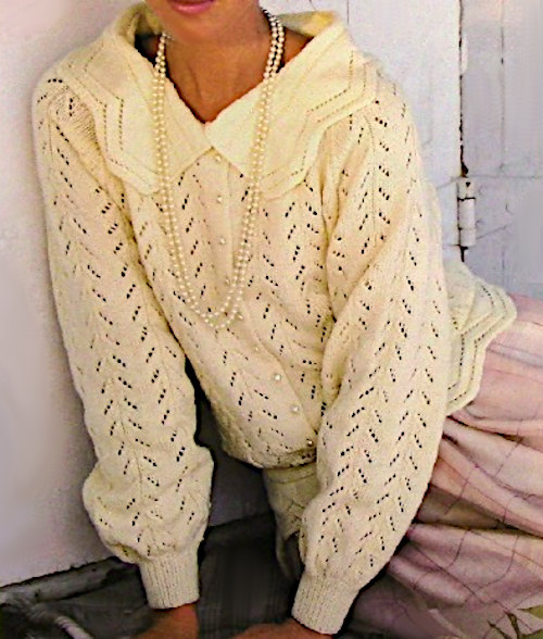Woman Wearing a White Long Sleeve Pullover Knit in Eyelet Lace Vertical Pattern from a Vintage Knitting Pattern for Sport Yarn and Sizes S, M, L.