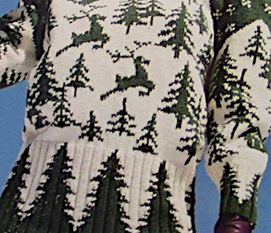 A Close-Up of a Winter Pullover Featuring Fir Tree and Reindeer Motifs in White and Green, Worn by a Model, from a Knitting Pattern for Worsted Medium Weight (4) Yarn, for Sizes S, M, L.
